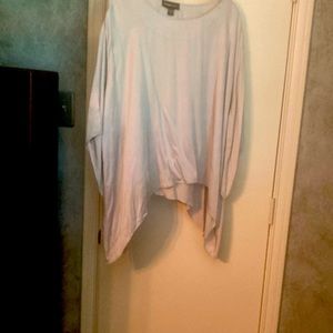Satin top that is flared and longer on the sides